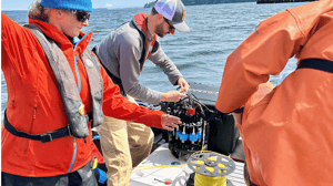 The NOAA and UW crew prep the Ascension eDNA depth sampler for ocean deployment