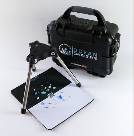 Saturna Imagine System sits overtop of microplastics that have been placed on a background sheet Saturna Imagine System sits overtop of microplastics that have been placed on a background sheet