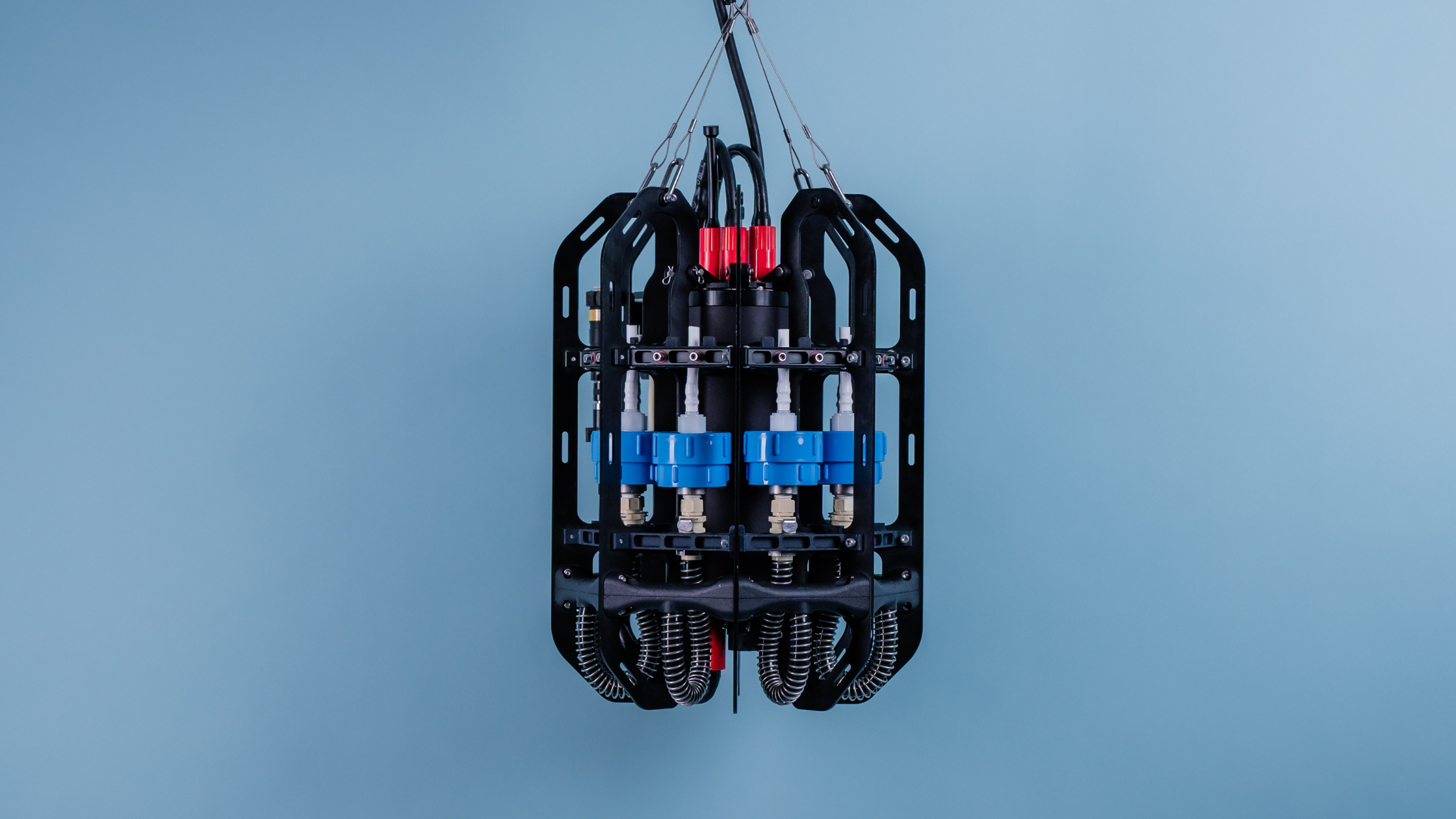 Ascension automated microplastics depth sampler is featured infront of a blue backdrop